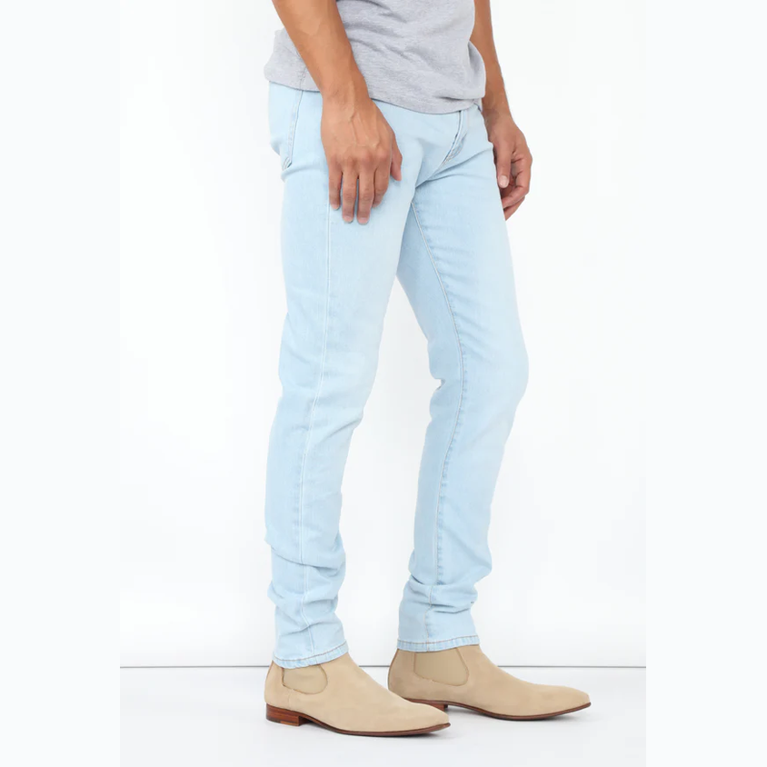 VacationGrabs mens slim fit jeans light blue paired with beige boots and gray shirt