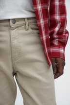 VacationGrabs mens slim fit khaki jeans worn with white shirt and red plaid jacket