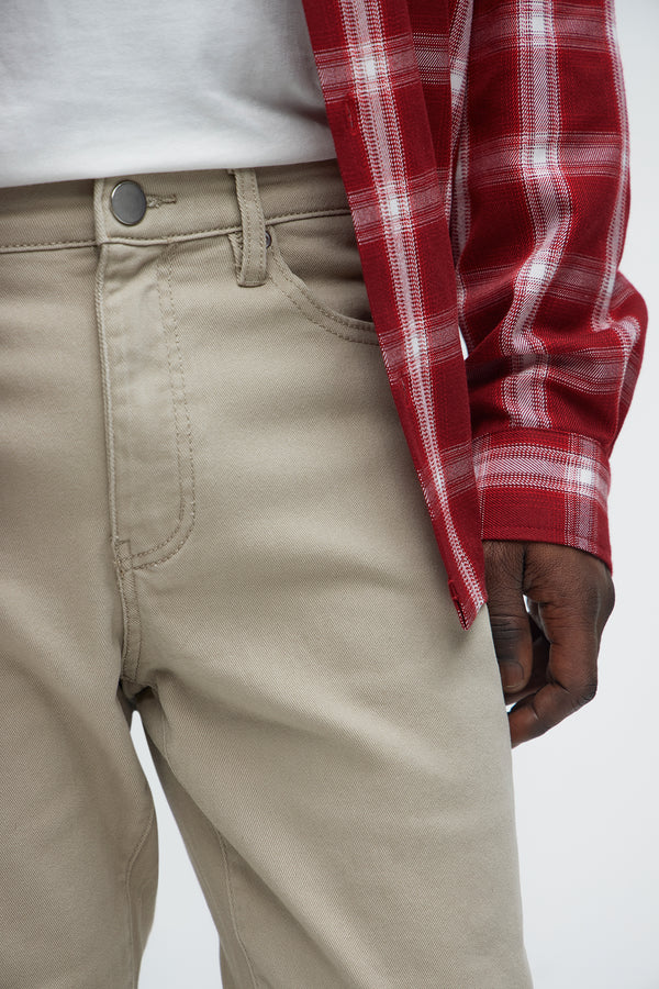 VacationGrabs mens slim fit khaki jeans worn with white shirt and red plaid jacket