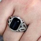 Men's stainless steel ring featuring an onyx stone with intricate filigree design