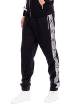 Stylish WEIV mens track suit featuring black pants with snake print side stripes for activewear