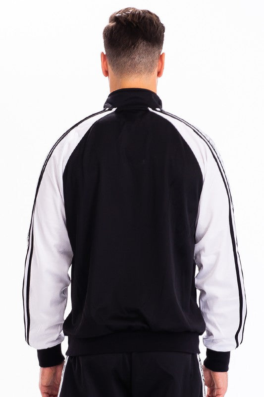 Back view of WEIV men's track suit featuring black and white colorblock design with stripes