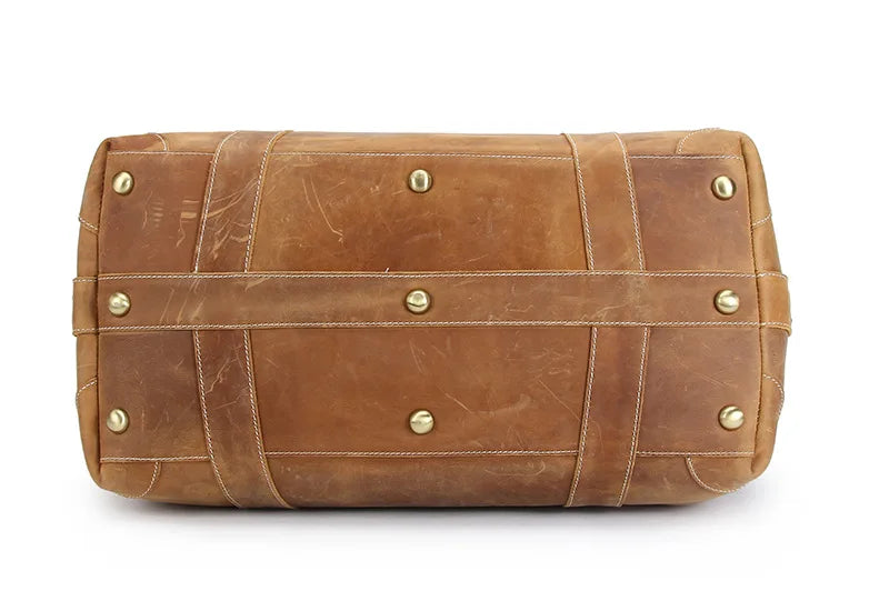Men's brown leather travel bag with durable brass studs