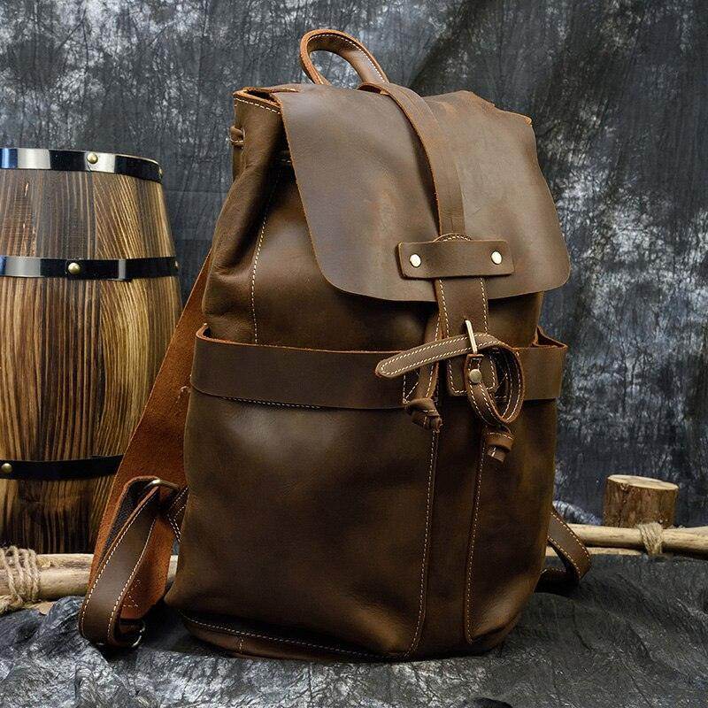 Mens vintage leather backpack with adjustable straps and spacious main compartment for travel and outdoor use