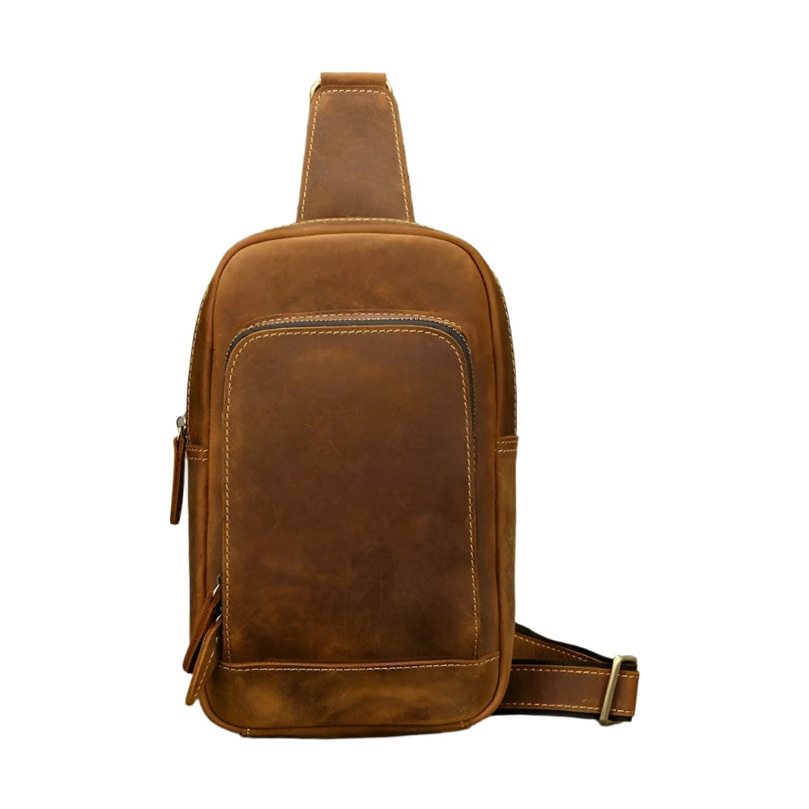 Mens vintage travel chest bag in brown leather with a sleek design and adjustable strap for comfort