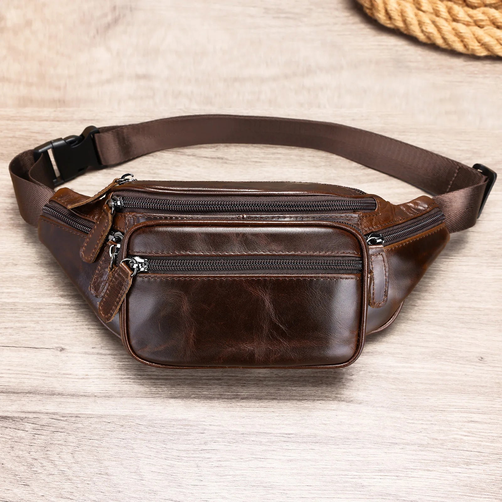 Brown leather mens waist bag with multiple zippered pockets