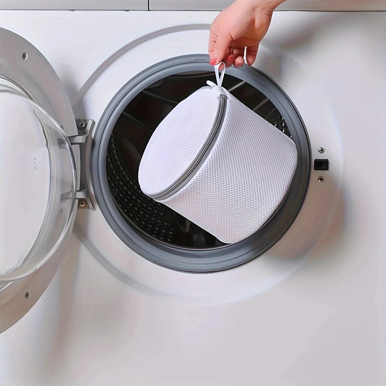 White mesh bag laundry for delicate items in washing machine