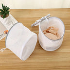 White mesh bag laundry for delicate clothing and fabrics
