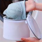 White mesh bag laundry for delicate items, protecting garments in wash