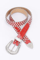 Red metal studded fashion belt with a shiny finish and decorative buckle for stylish women