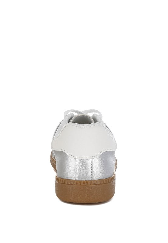 Women's metallic lace-up sneakers in white with silver accents