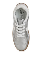 Women's metallic lace-up sneakers in silver, perfect for casual outings