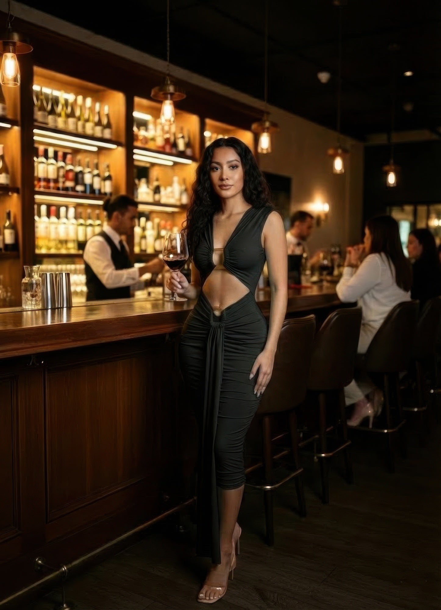 Black midi dress with cutout details, perfect for evening events