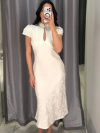 Elegant ivory midi dress, lightweight fabric, perfect for special occasions