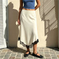 Women's cream midi satin skirt with lace trim, stylish summer outfit