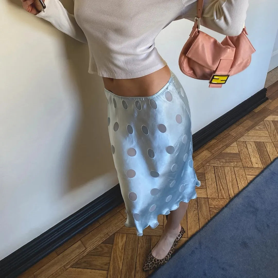 Women's blue midi skirt with polka dots, perfect for casual outings