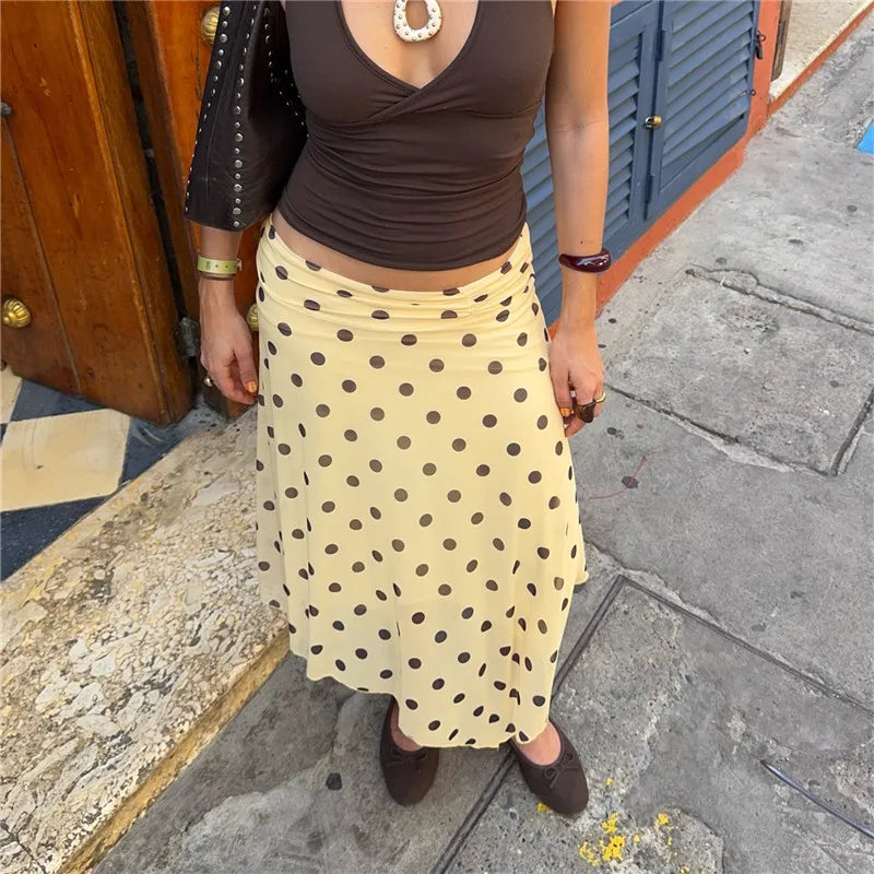 Women's yellow midi skirt with brown polka dots, stylish for summer outings