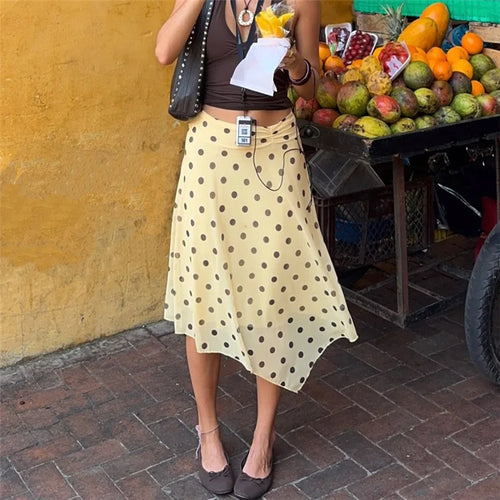 Women's yellow midi skirt with polka dots, perfect for casual outings