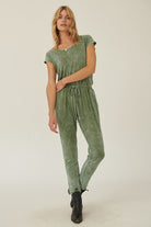 Stylish mineral washed knit jumpsuit in soft green with a comfortable fit and drawstring waist