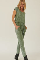 Stylish women's mineral washed knit jumpsuit in green with pocket details for comfortable wear