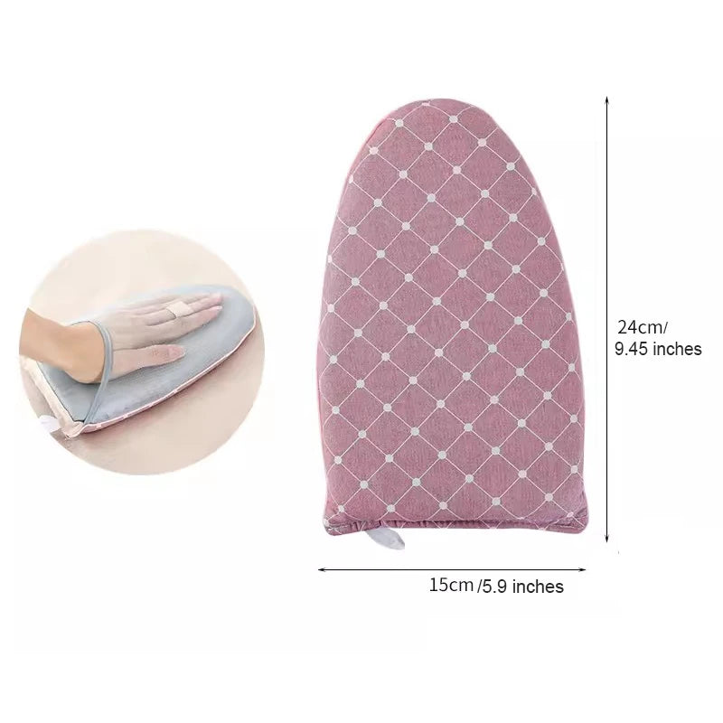 Mini ironing board heat resistant, pink quilted cover for easy use.