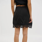 Women's black mini skirt, satin material with lace trim