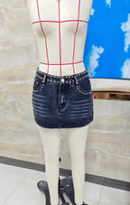 Black denim mini skirt with studs, perfect for casual outings