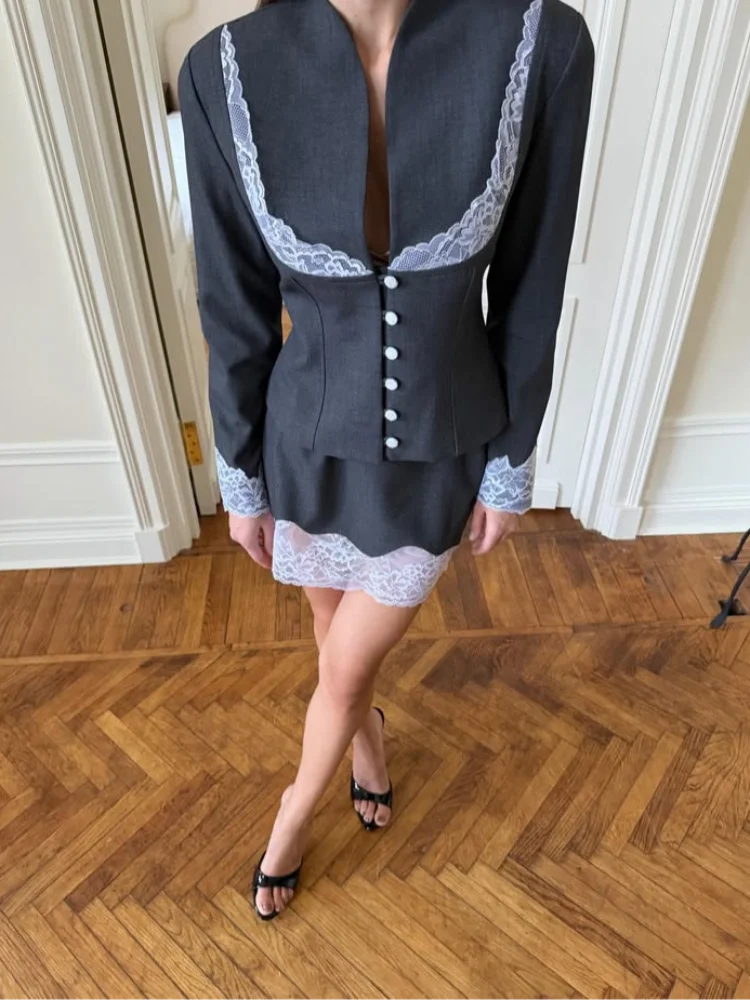 Women's black mini skirt and matching blazer set with lace details