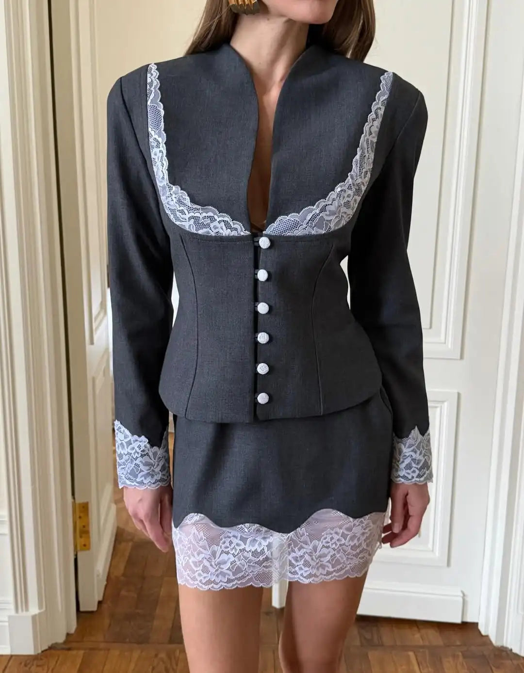 Gray mini skirt with lace trim, perfect for stylish outings
