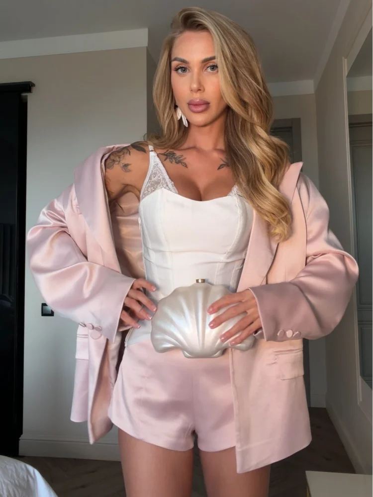 Women's satin mini skirt with a stylish blazer for a chic outfit