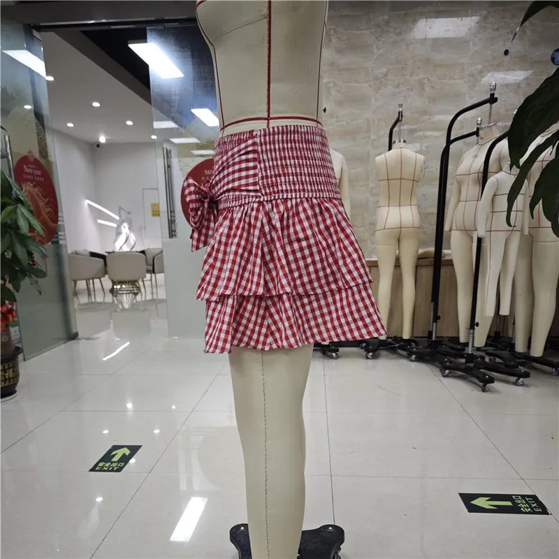 Women's red and white gingham mini skirt, perfect for summer outings.