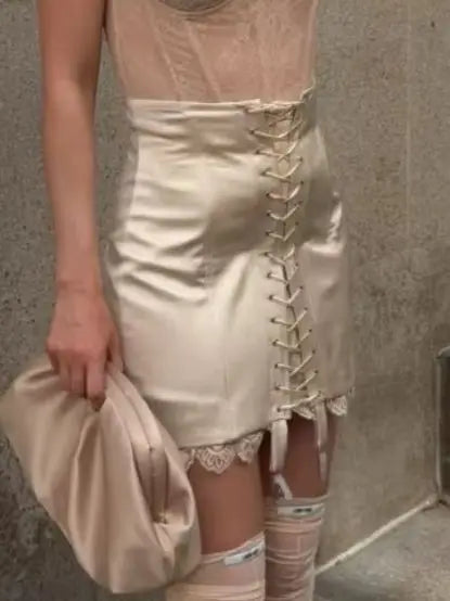 Women's satin mini skirt with lace-up front detail, stylish for nights out