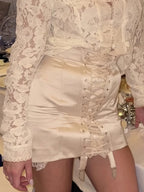 Women's satin mini skirt with lace-up front for stylish occasion wear
