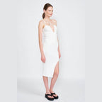 Elegant white midi dress with a deep neckline and side slit, perfect for warm weather styling