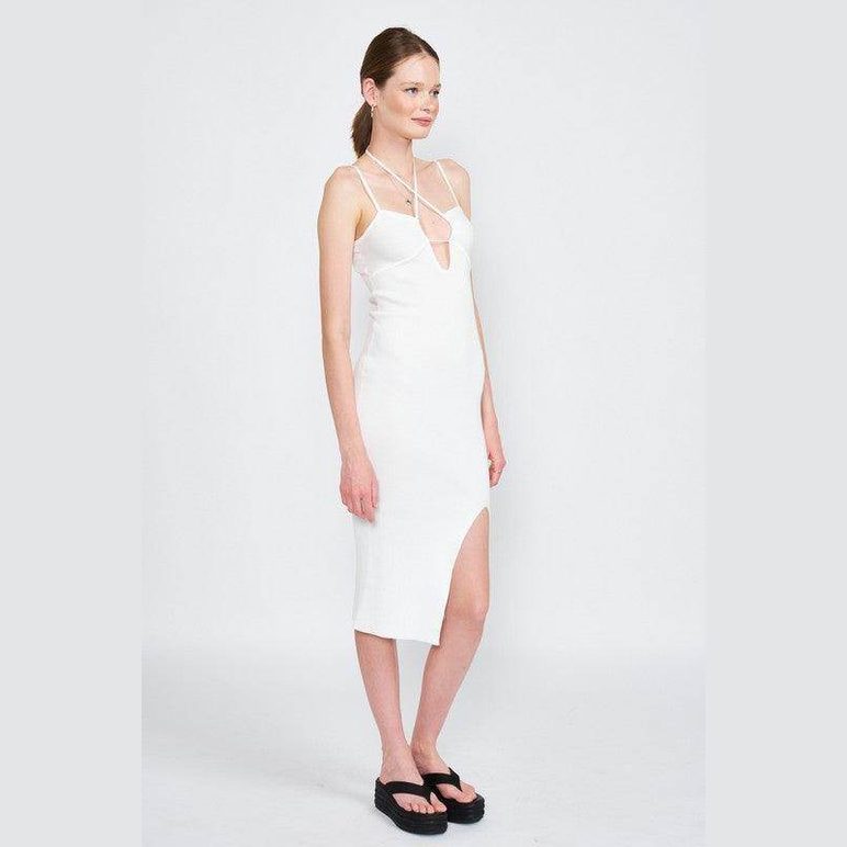 Elegant white midi dress with a deep neckline and side slit, perfect for warm weather styling