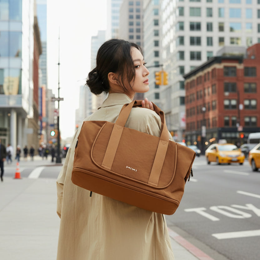 Brown duffle bag for travel, made of durable fabric