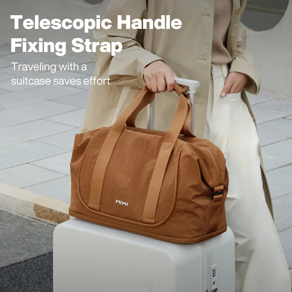 Brown duffle bag with telescopic handle fixing strap for convenient travel