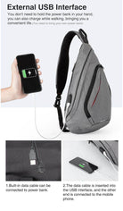 Gray USB charging crossbody backpack with external USB interface for convenient mobile device charging