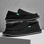 Mens comfortable shoes in black canvas with slip-on design for casual wear