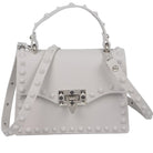 Stylish monotone studded clutch bag with a detachable strap and decorative studs for modern fashion.
