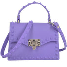 Monotone studded clutch bag in lavender with adjustable strap and unique stud design