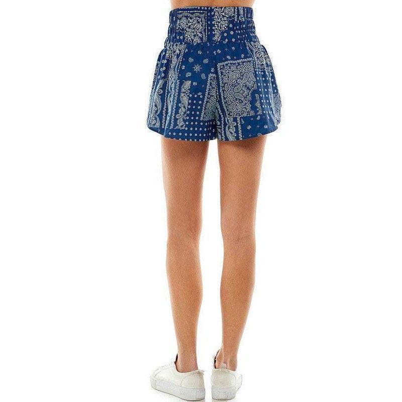 Back view of TCEC women's navy blue athletic shorts featuring a stylish patterned design