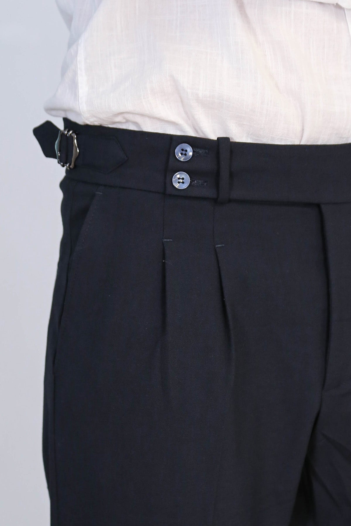 Navy Double-Pleated High-Waisted Slim Fit Trousers with Side Buckles – detail view