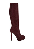 Maroon knee-high boot with high heel on a light gray background