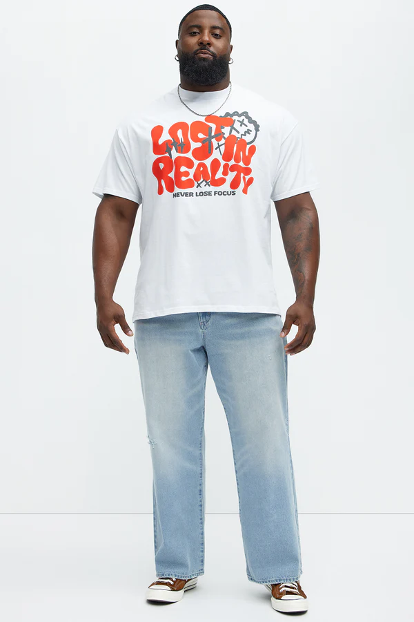 Men's white never lose focus t-shirt with bold red graphic worn with light blue jeans and sneakers