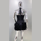 Back view of a black nightclub bandage dress for women with lace-up corset and ruffled skirt