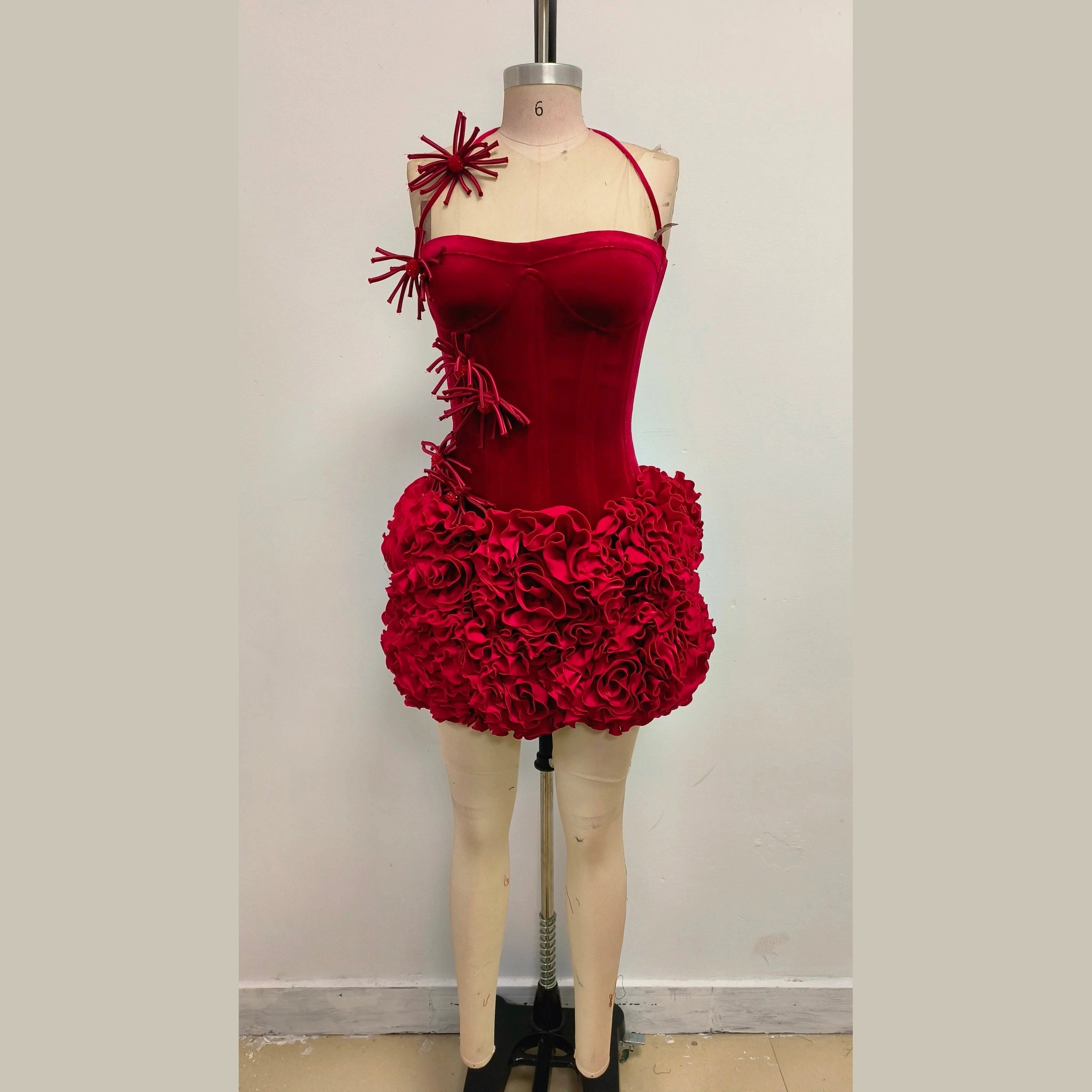 Red nightclub bandage dress for women with floral ruffle details and unique shoulder design