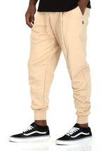 Men's beige Nike mens joggers, soft cotton blend for casual wear