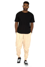 Nike mens joggers in cream, lightweight fabric for casual wear