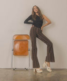 Oasis Society Norah chunky platform heels in white showcased with flared striped pants